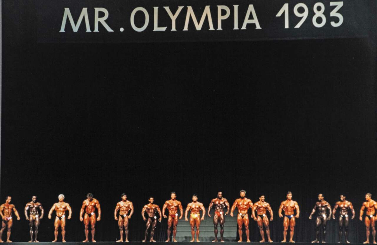 Bodybuilder-Olymp: Teilnehmer der "Mr. Olympia"-Wahl 1983 auf der Bühne in München. Dort, bei der Veranstaltung der International Federation of Bodybuilding & Fitness (IFBB), trafen sich die weltbesten Bodybuilder zum Wettkampf